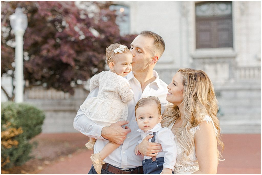 Fall family photos in front of stone buildings in Annapolis Maryland

